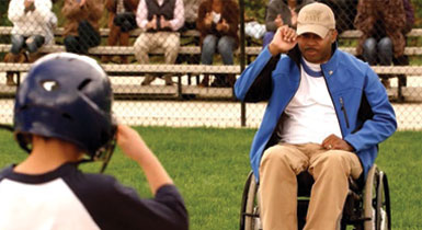 paralyzed veteran on a baseball field